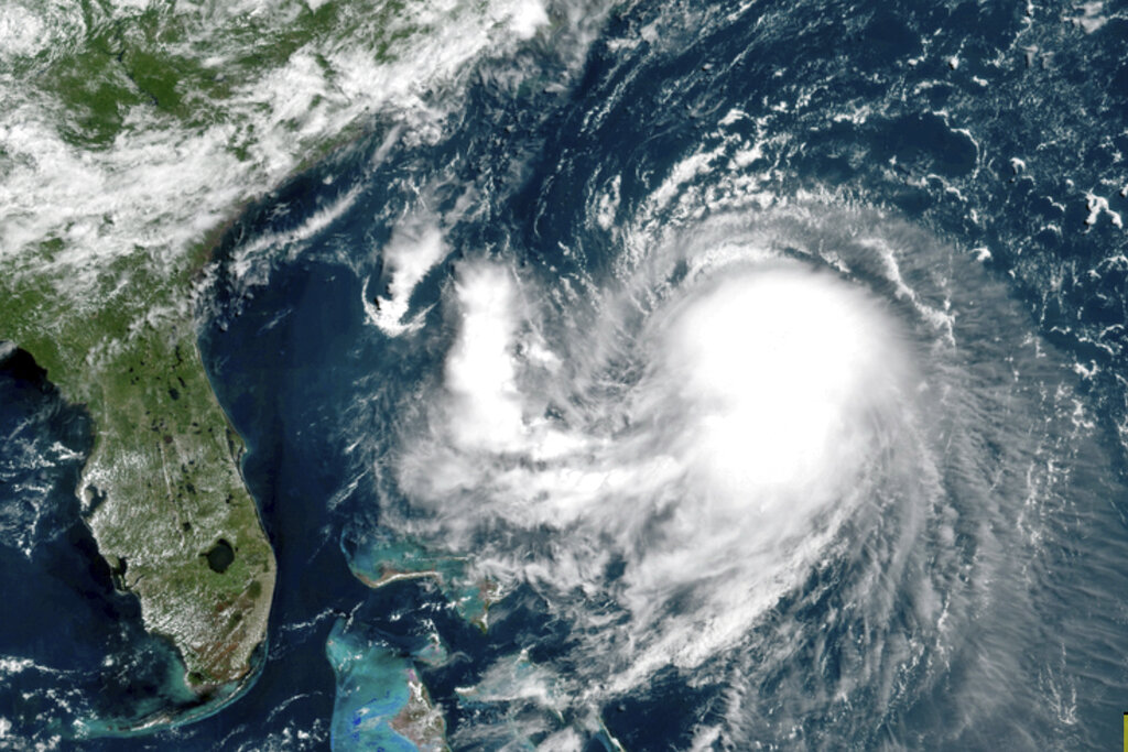 This OES-16 East GeoColor satellite image taken Friday, Aug. 20, 2021, at 11:40 a.m. EDT., and provided by NOAA, shows Tropical Storm Henri in the Atlantic Ocean. (NOAA via AP)