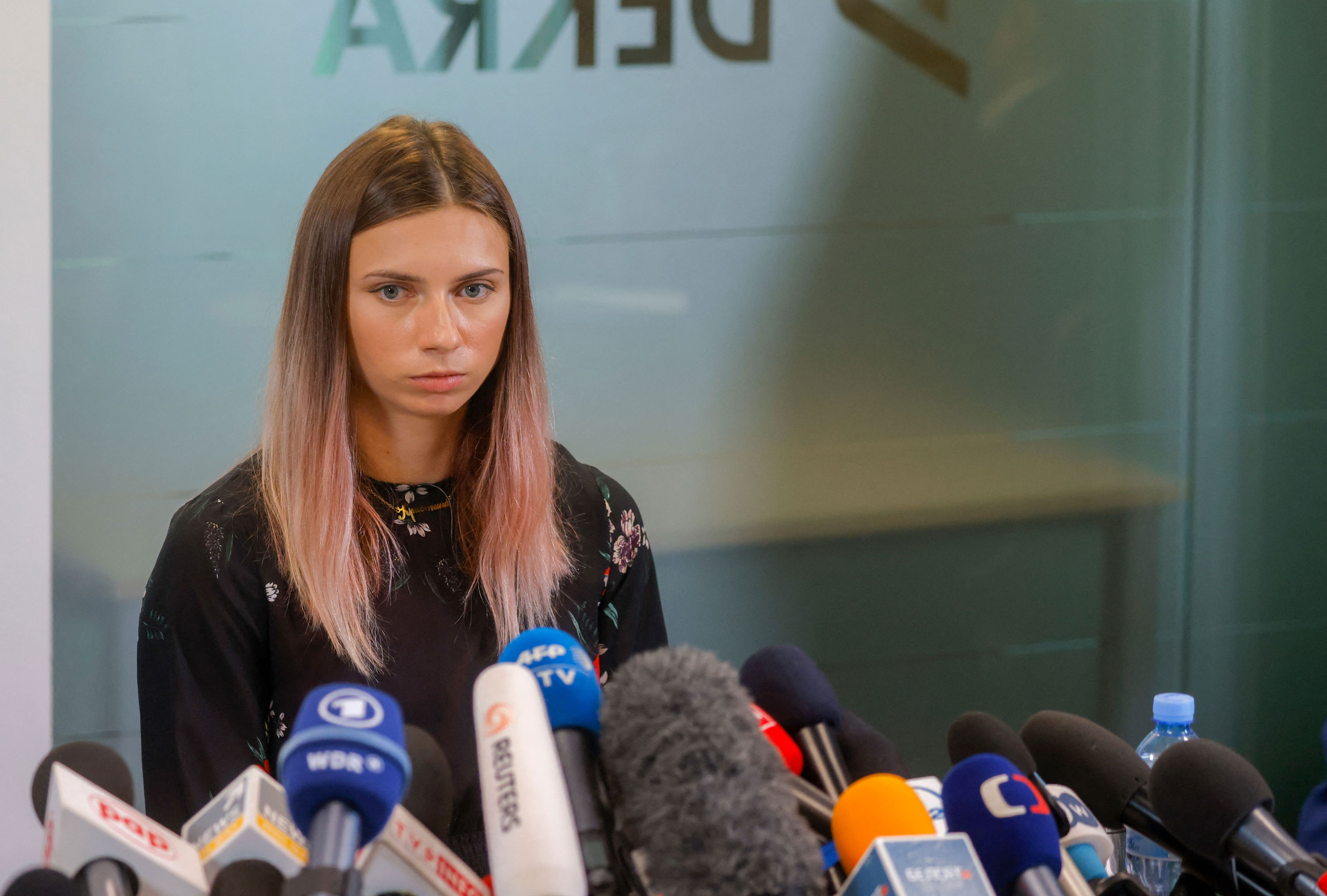Belarusian Olympic athlete Kristina Timanovskaya addresses a press conference on August 5 in Warsaw, Poland. 
